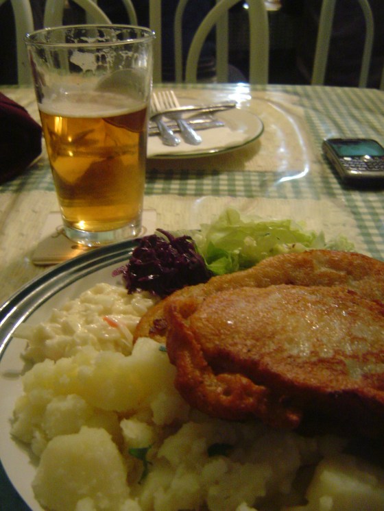 Belehradsky Bravcovy Rezen pork breaded in potato batter w. potatoes, cole slaw and beet cabbage salad