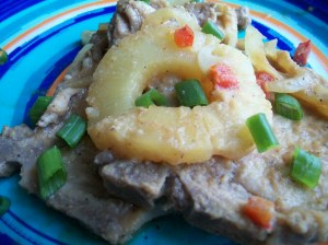 Sweet and Sour Pork Chops Garnished with Pineapple and Green Onions